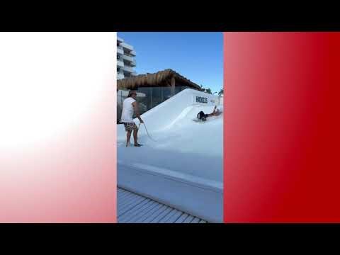 Woman Loses Balance on Surf Simulator and Crashes - 1763922