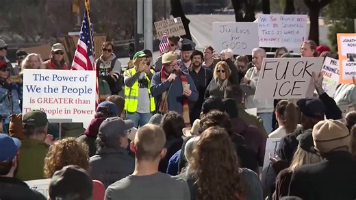 At least 100 protesters have gathered at Austin City Hall for today's ICE Out of Austin protest. | CBS Austin