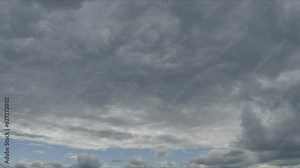 Sky background with blue sky and natural texture and pattterns of moving clouds - time lapse. Topics: weather, nature, meteorology, air, toposphere