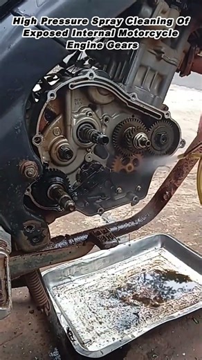 High Pressure Spray Cleaning Of Exposed Internal Motorcycle Engine Gears