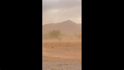 Powerful winds sweep dust across rural land in Hereford, Arizona, USA