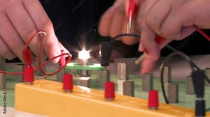 Testing an Electronic Circuit Board in a Physics Science Lesson at School