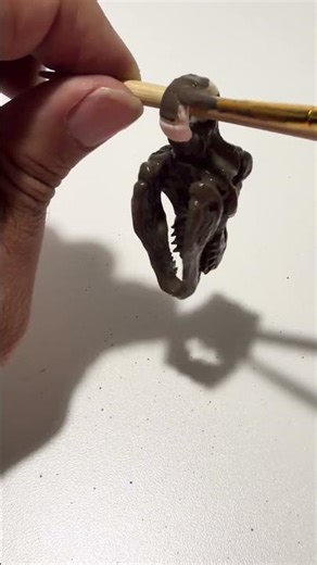 Mini Dino keychain coated with our Aged Fossil mix. #3dprinting #sculpture #trex #diycraft #clay