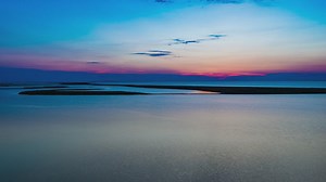 Sunrise seen from a river, landscape - Free Stock Video