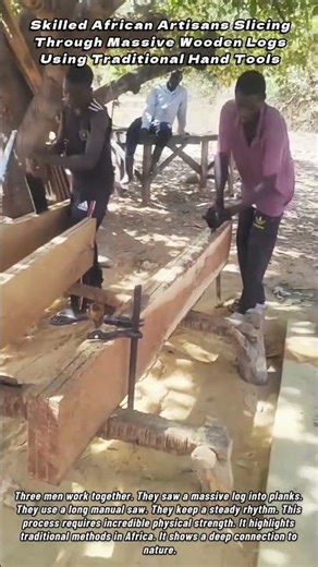 Skilled African Artisans Slicing Through Massive Wooden Logs Using Traditional Hand Tools