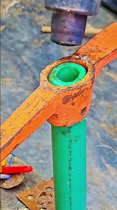 Green PVC pipe fitted securely with striking tool