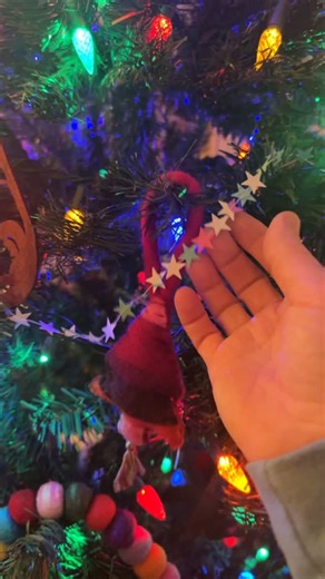 Jill Bleher 🌿 WildColorCrafts on Instagram: "This simple Christmas craft has been so fun this year! It started by hole punching mixed craft papers (construction paper, art by my toddler, wrapping paper), then time to sew! I’m using the sewing machine I inherited from my grandmother and I especially love to remember her this time of year. Rosemary is very into watching and helping as she can. I’ve made a number of these garlands for the tree and they are so delicate and colorful! #christmascraft