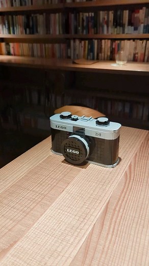 Zung Hoang on Instagram: "Fully Functional and Working Lego Camera - ZH1. Explore how LEGO bricks can teach complex engineering principles through play! This custom LEGO camera, is a detailed, functional model that replicates the mechanics of a real camera. 📸 The project involves over 600 LEGO pieces and demonstrates the use of gears, levers, and shutter to simulate the internal workings of a camera. Ideal for teaching physics, and mechanical engineering, this build is a perfect example of how 