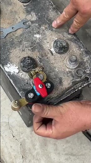 quick-release battery terminal connector being installed or connected to a car battery #repair