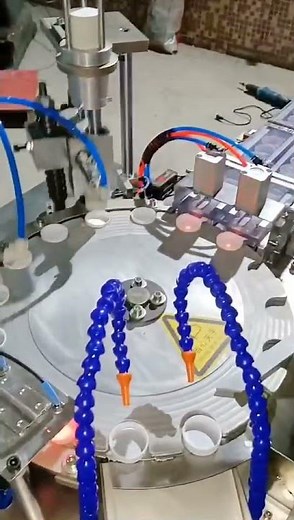 Rotary dual head cap wad foil liner inserting wadding lining machine