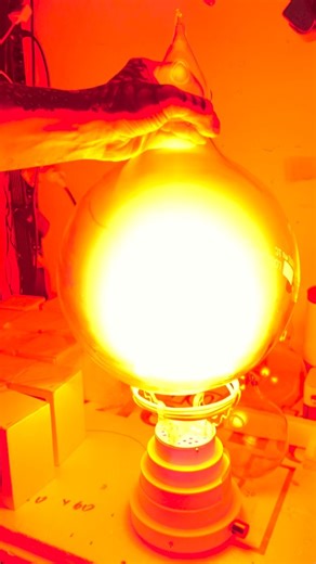 Zerg Labs & TeslaCoilPro on Instagram: "The BAGELGEUSE 10L neon plasma flask vs 1L Carbon Flame BagelFlask #bagelgen #betelgeuse #star #neonlights"