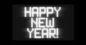 "HAPPY NEW YEAR!" animated in various ways on a scoreboard dot matrix. Slow crawl-in, fast crawl-in, fade-in, blinking and typing. Black-white tonal scheme, cinematic glow.