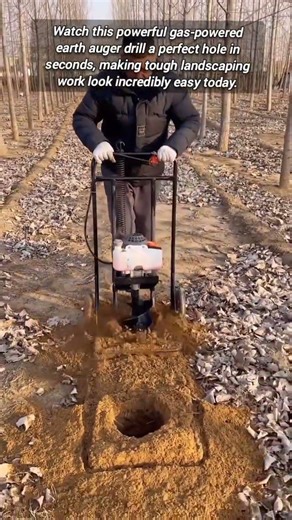 Professional Grade Post Hole Digger Working On Sandy Ground