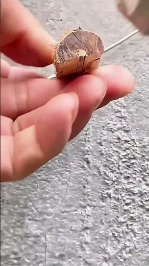 Attaching a small wire to the wall using glue and a protective pipe for neat electrical installation