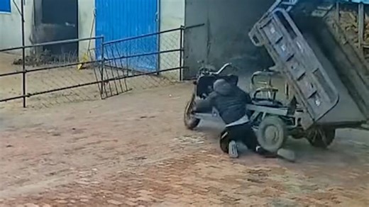 Runaway mini truck speeds across courtyard before crashing into pen barrier