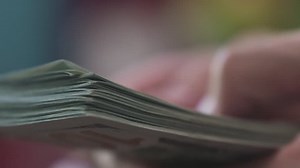 slow motion macro man hands counting dollars