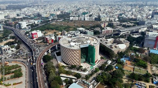 The aerial view of Cyber Towers stands as HITEC City’s iconic landmark—its circular façade and glass core anchoring Hyderabad’s thriving tech corridor.