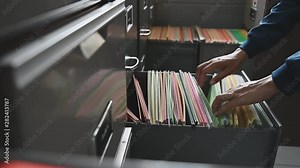 colorful documents placed in the filing cabinet