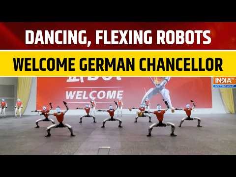 German Chancellor Merz Greeted by Dancing, Boxing & Flexing Robots in China Visit | World News