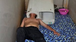[Watch] How not to do DIY...man gets his head stuck in washing machine. | Euronews English