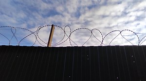 Download Prison fence with metal barbed wire 4K video footage for free