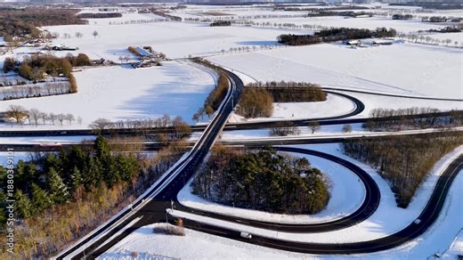 Network Of Looping Ramps Paints Complex Patterns Across Snowcovered Rural Countryside Scenes