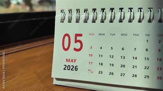 Slow motion footage of flip calendar pages for change months from april to may of the year 2026. concept of planning and starting a new month. 4k horizontal