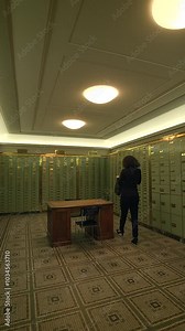 Bright green lockers in an unoccupied locker room with modern lighting for a contemporary vibe