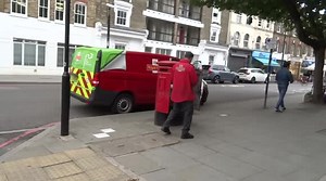 Royal Mail postie forgets a set of keys inside red mail box on Pentonville Road in King's Cross - London