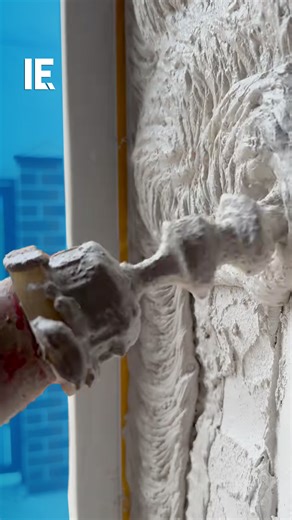 This spiraling tool applies cement mortar around the window frame. 🎥 timur_krd_remont / IG | Interesting Engineering