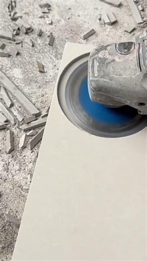 A ceramic that is being perforated using a special tool neatly