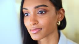 Business woman reading information on a computer screen while working...