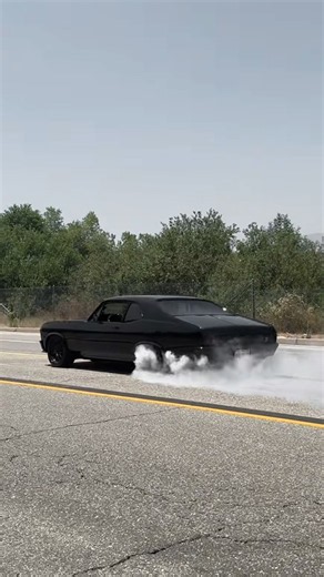 Murdered out Nova with 1000HP performs a massive burnout