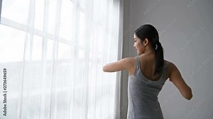 Holiday concept. Women are waking up in the morning in the room.
