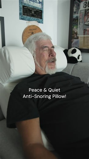 This anti-snoring pillow literally saved my marriage! This is the Snorinator pillow! The Snorinator anti-snore pillow helps reduce snoring by keeping your head and upper body slightly elevated while you sleep, which helps keep your airway open. It’s designed to hold you in a better sleeping position so you breathe more easily and snore less. #antisnoring #snoring #sleepessentials #bettersleep | The Snorinator