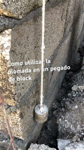 How to use a plumb line for laying concrete blocks