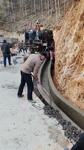 Construction of a Concrete Drainage Channel Along a Mountain Roadside