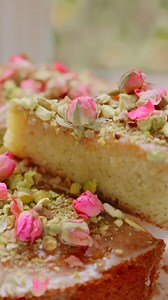 Persian Love Cake—moist, light, and beautifully fragrant with citrus, cardamom, cinnamon, and rosewater. Topped with a tart lemon glaze, rose petals, and pistachios, it’s the perfect sweet treat for Valentine’s Day! | The Mediterranean Dish