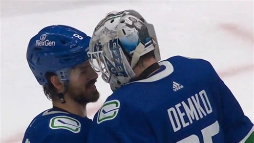 Canucks top flames in home opener