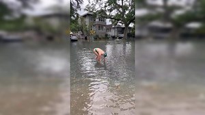 Swimmer Dives Into a Flooded Street After Water Line Breaks, 'Bad Idea', Say Netizens
