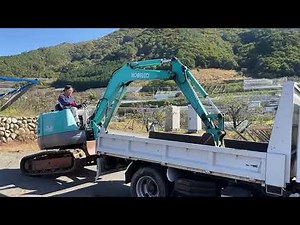 ユンボをダンプに乗せるやり方