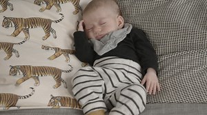 Cute baby sleeping on a couch - Free Stock Video