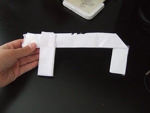 Comment faire un pistolet en papier qui tire un élastique