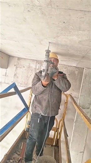 Drilling Overhead Concrete Ceiling with Precision and Safety Gear