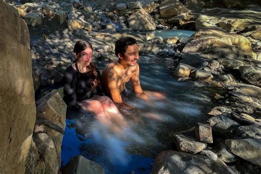 Behind this wealthy SoCal neighborhood, you can soak in a rustic hot spring oasis