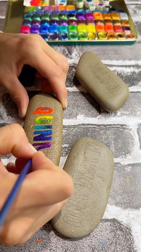 Name stones for the kiddos 🥰 my 4yo has an ugly version and he carries it around asking what each letter is, so I had to make more if it helps them learn 😌 watercolour paints by @iuilewatercolors Save 5% on your watercolours purchase using the link in my bio! Or copy and paste (click if fb). iuilewatercolors.com?sca_ref=4432036.YWInpTnCMk . . . . . #art #watercolours #watercolors #howtopaint #mixedmediaart #rhinestones #acrylicart #acrylics #paintcones #dotart #dotmandala #howtopaint #paintedr