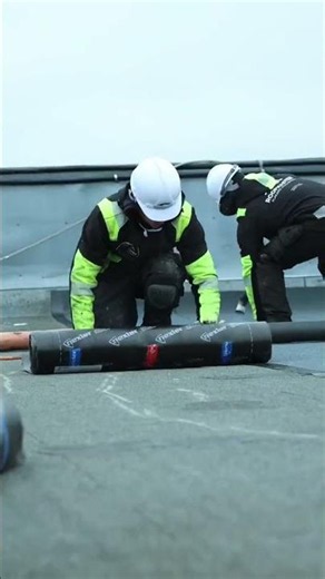 Professional flat roofing in progress