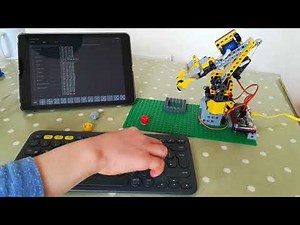 Lego Technic robot arm, controlled by Raspberry Pi, picking up bricks