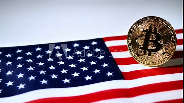 A gold Bitcoin coin is positioned on a folded American flag, captured from a smooth horizontal panning video shot, symbolizing digital currency's role in the U.S.