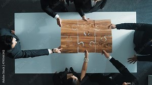 Top view of skilled businesspeople hand bring and fill the last jigsaw piece together. Group of project manager complete puzzle or solving problem. Unity, teamwork, successful project. Directorate.